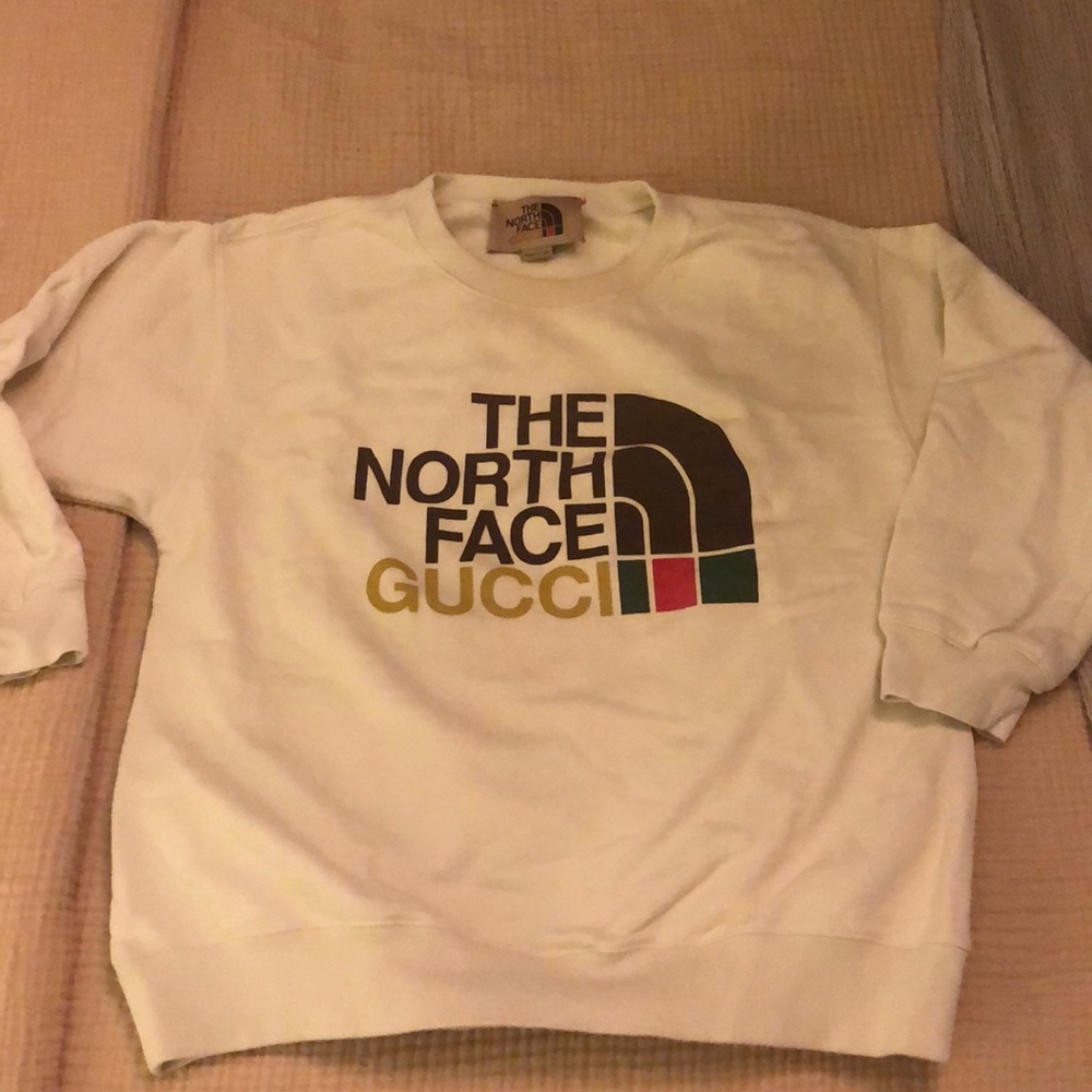 I am selling an XS Gucci x North Face collab Sweatshirt